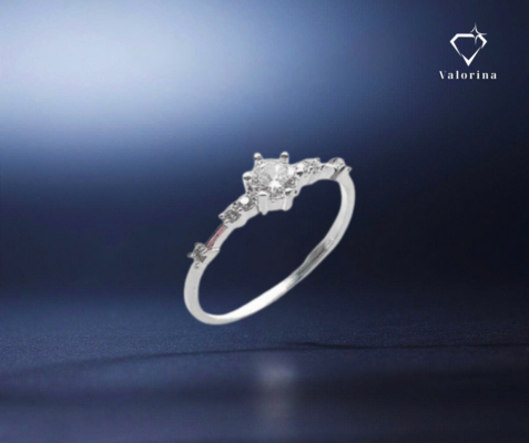 a silver ring with a diamond in the middle